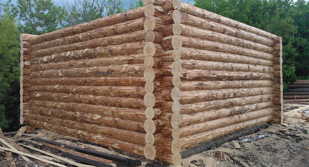 Строительство домов из окорённого бревна